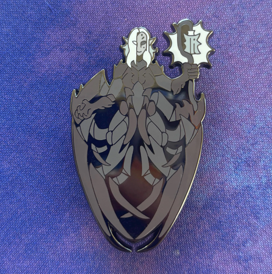 Karniss Pin with a dark, armored figure holding a staff.