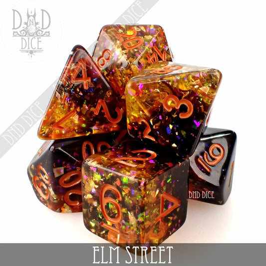 7-piece set of glittery orange, gold, and black resin polyhedral dice with red numbers, Elm Street variant.