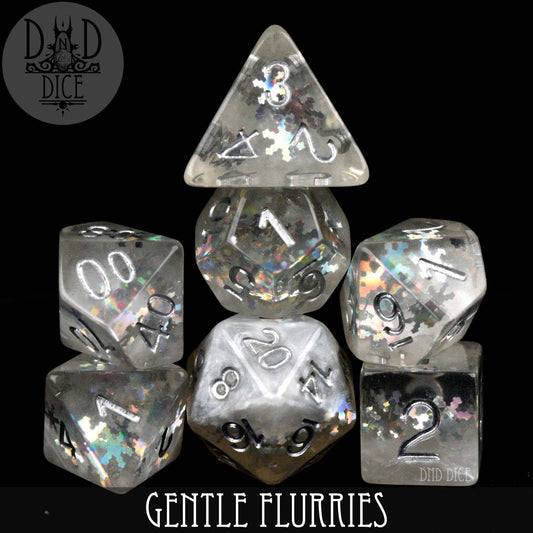 Gentle Flurries 7-piece translucent polyhedral dice set with silver numbers and snowflake glitter in a bottle.
