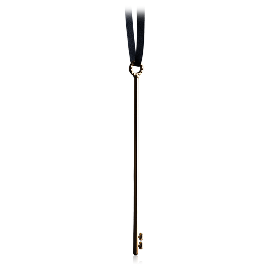 Brass skeleton key puzzle on a black ribbon.
