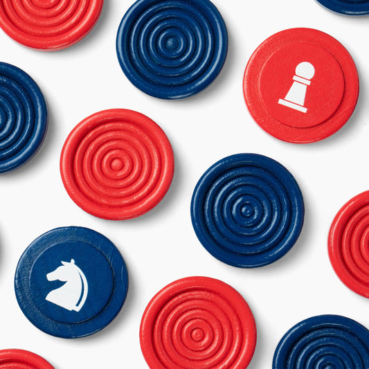 Red and blue circular pieces for Canvas Classics Chess & Checkers, with some displaying white chess symbols.