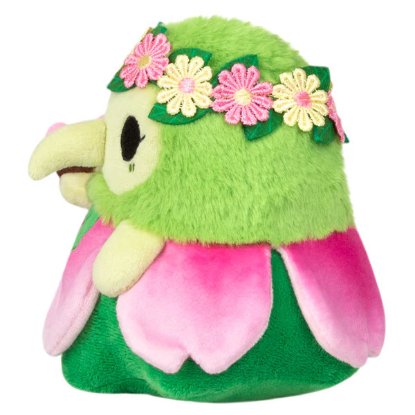 The Alter Ego Plague Doctor - Nymph green plush bird with flower crown and pink petals, side view.