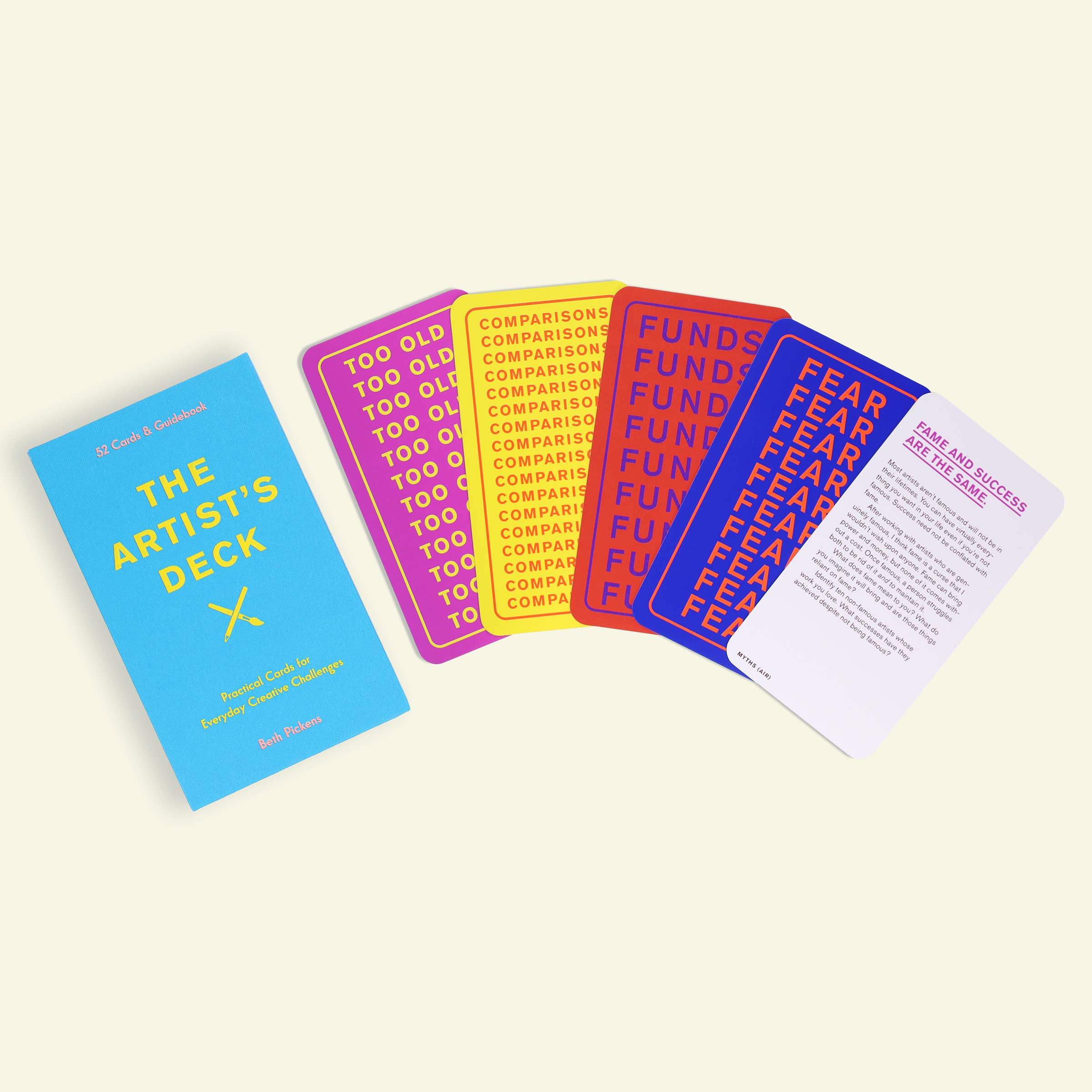 The Artists Deck product includes six colorful cards and a blue booklet on a plain background.