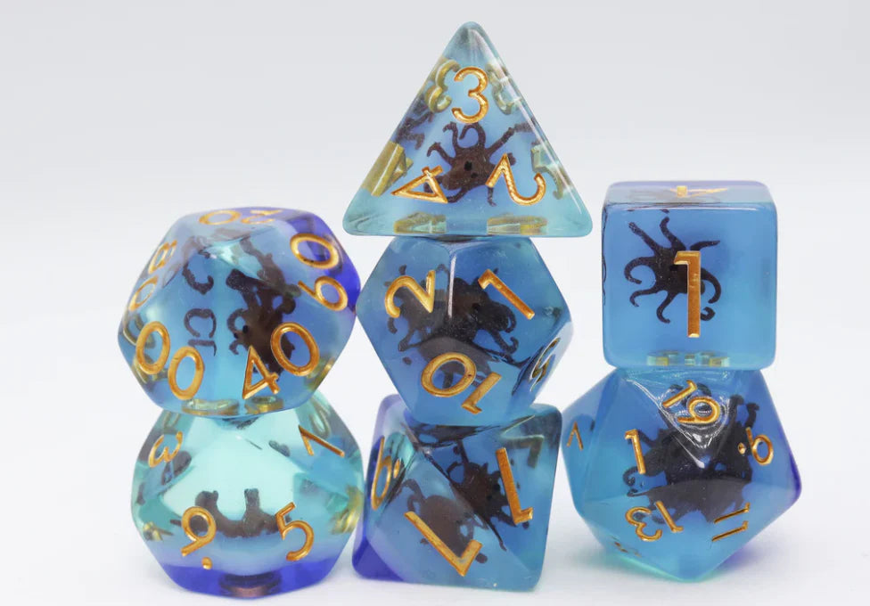 Coffee Octopus RPG Dice Set with polyhedral dice featuring gold numbers and small black octopuses inside.