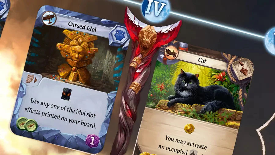 Cursed Idol and Cat cards from Lost Ruins of Arnak: Expedition Leaders Expansion with fantasy illustrations.