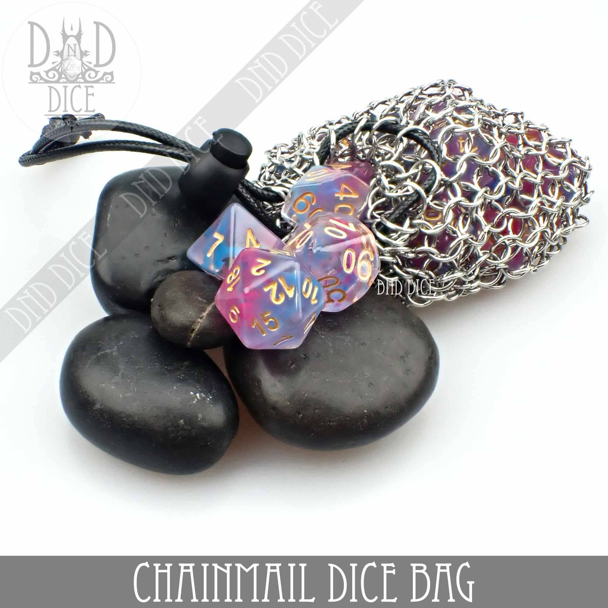 Chainmail bag containing purple dice, steel box, and black stones on a white background.