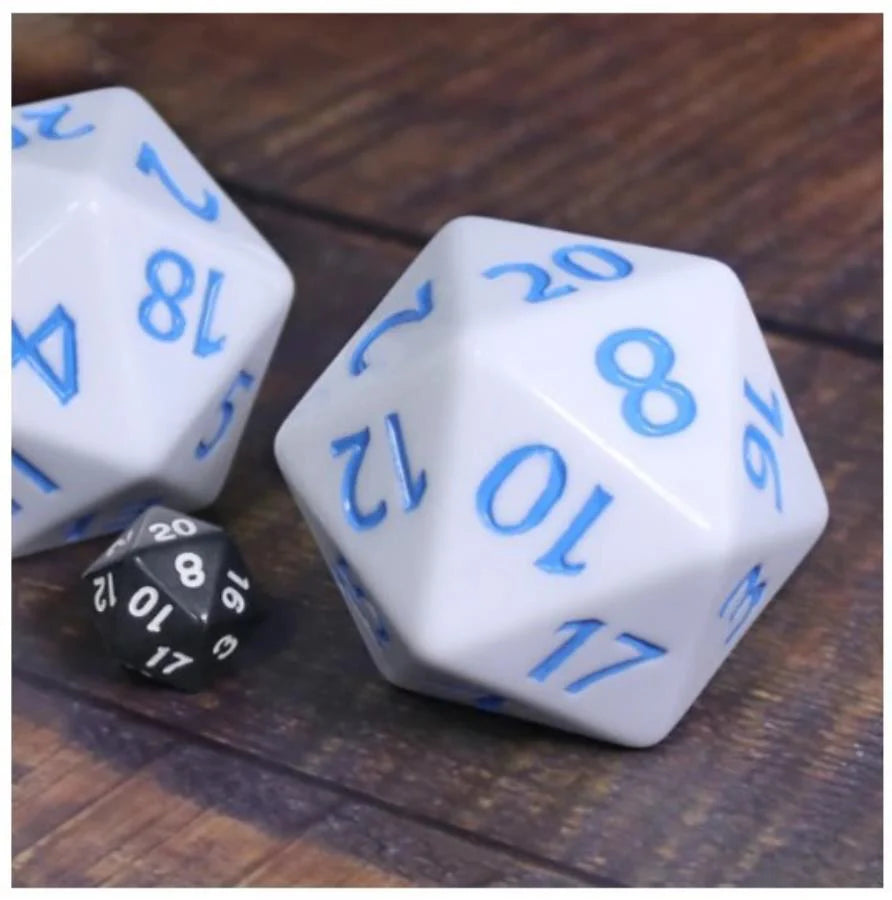 55mm Titan D20 in white with blue and a small black die on a wooden surface.