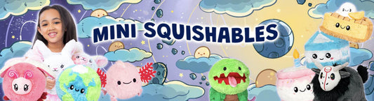 Girl holding Mini Squishable Plushies with cute faces.