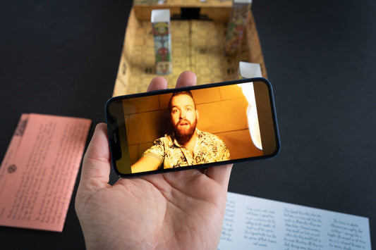 Man in Hawaiian shirt appears surprised while being filmed on a phone in Family Secrets Series Episode 3: Ancient Mysteries.