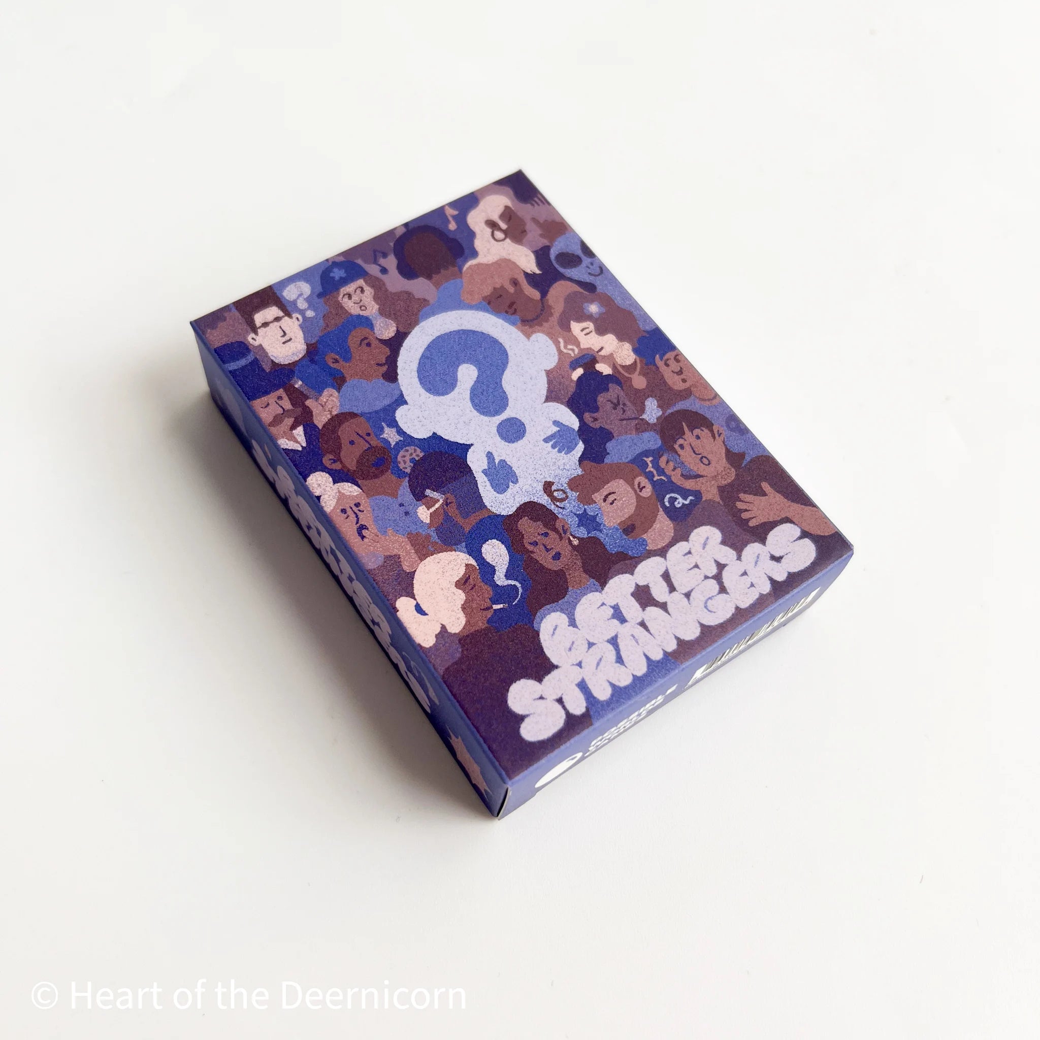 The Better Strangers card game box with illustrated faces, a question mark, and people-watching prompts.