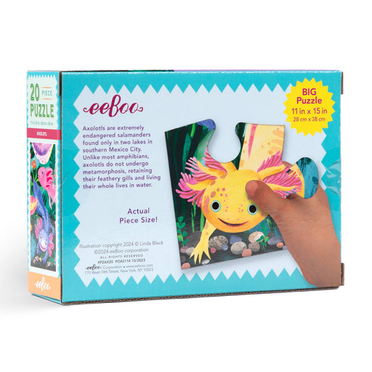 Axolotl 20 Piece Puzzle with a hand holding a jumbo puzzle piece featuring a pink axolotl.