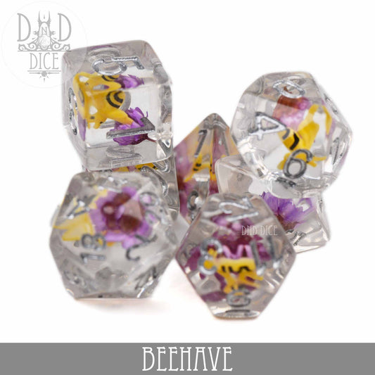 BEEhave 7-piece clear resin dice set with bee and flower designs and silver numbers for tabletop gaming.