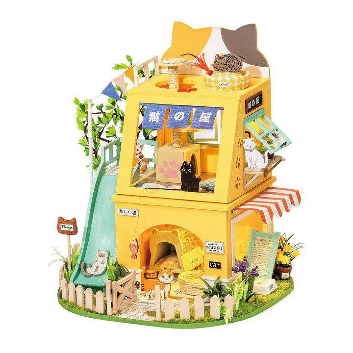 DIY Miniature House Kit: Cat House with cat figures, slide, plants, and playful decor.