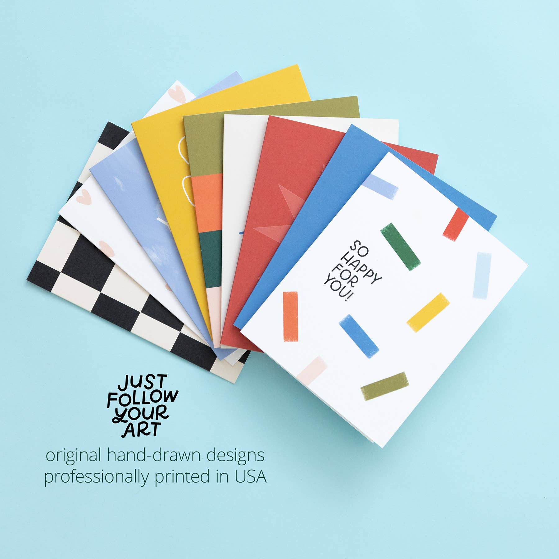 Stack of hand-drawn Season’s Treatings holiday greeting cards, one reading SO HAPPY FOR YOU.