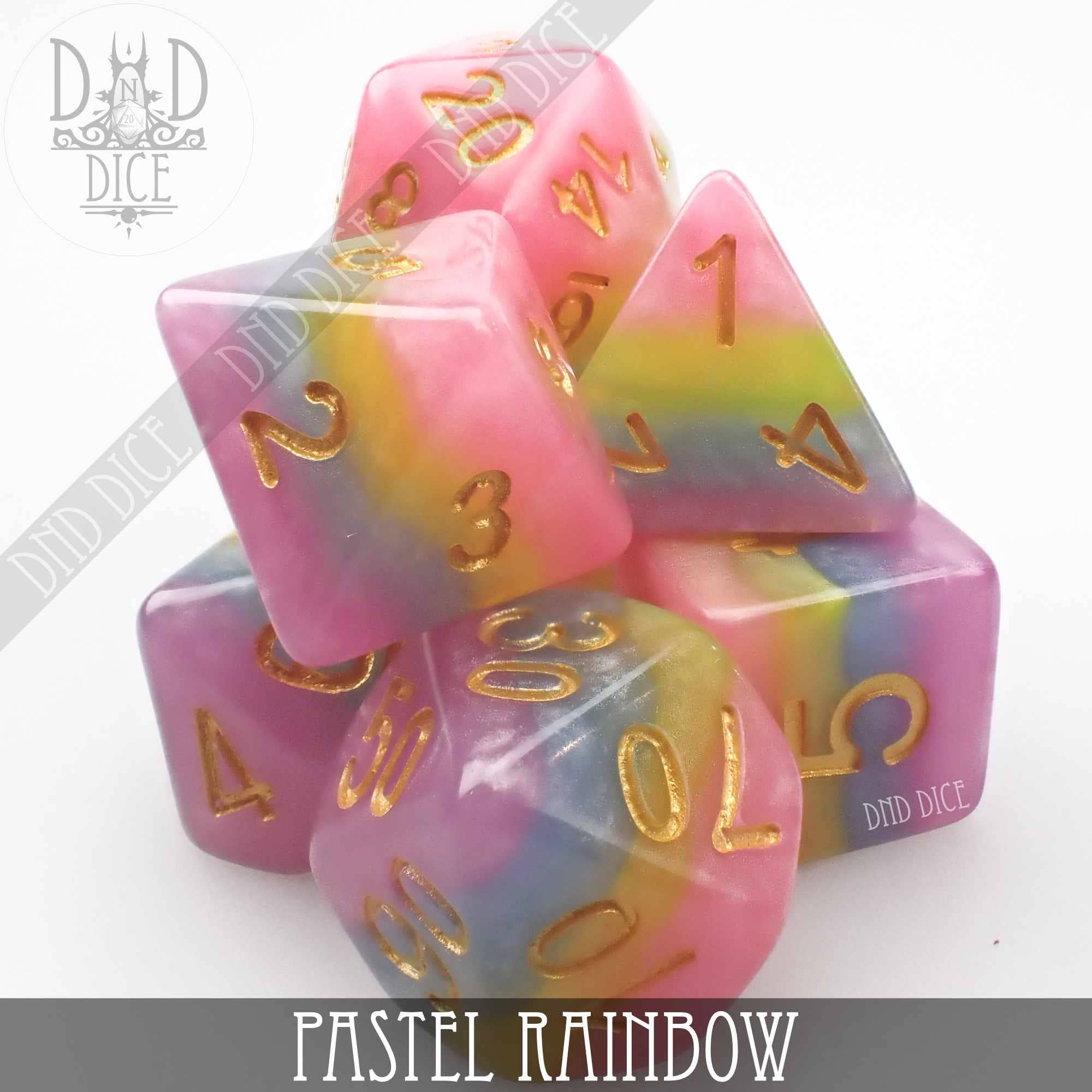Pastel Rainbow 7-piece resin DnD dice set with gold numbers on a white background.