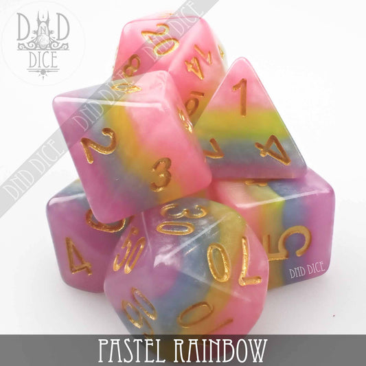 Pastel Rainbow 7-piece resin DnD dice set with gold numbers on a white background.