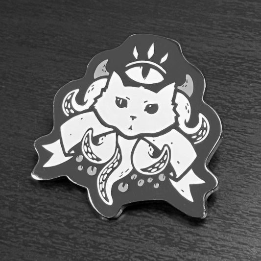 Black and white hard enamel pin depicting a cat with tentacles and a third eye, called The Warlock Enamel Pin.