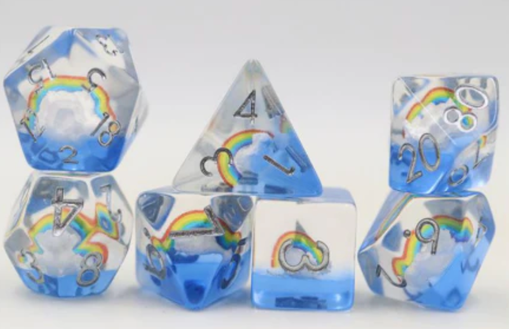 Beautiful Day RPG Dice Set with blue and clear polyhedral dice, silver numbers, and rainbow designs.