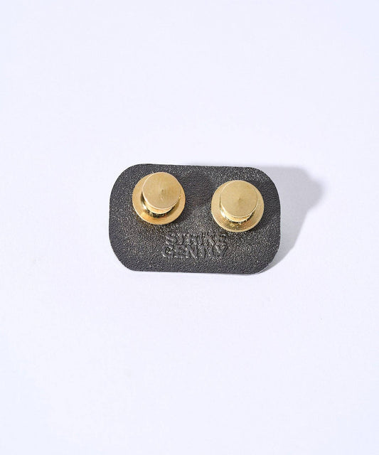 Back of a 1.25-inch Buy a man eat fish hard enamel pin featuring two gold-tone locking clasps and embossed brand text.