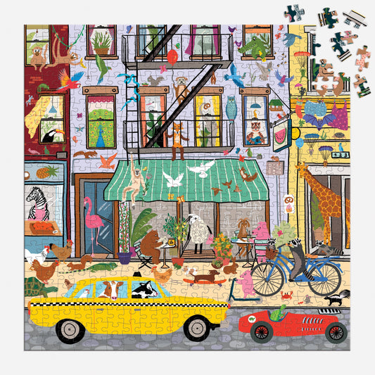 Critter City 500 Piece Family Puzzle with animals in a city, yellow taxi, bike, and birds on buildings.