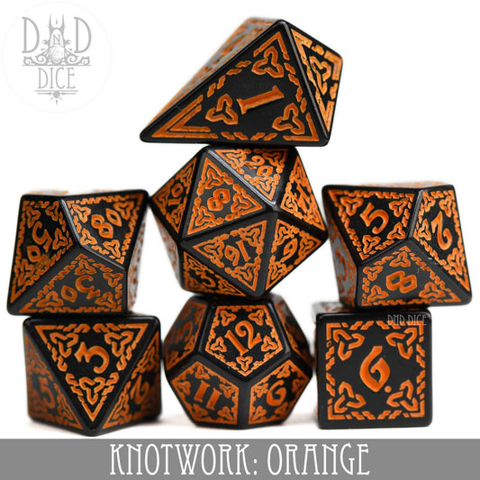 Knotwork: Orange set of seven acrylic dice with orange knotwork patterns, including a teardrop D4.