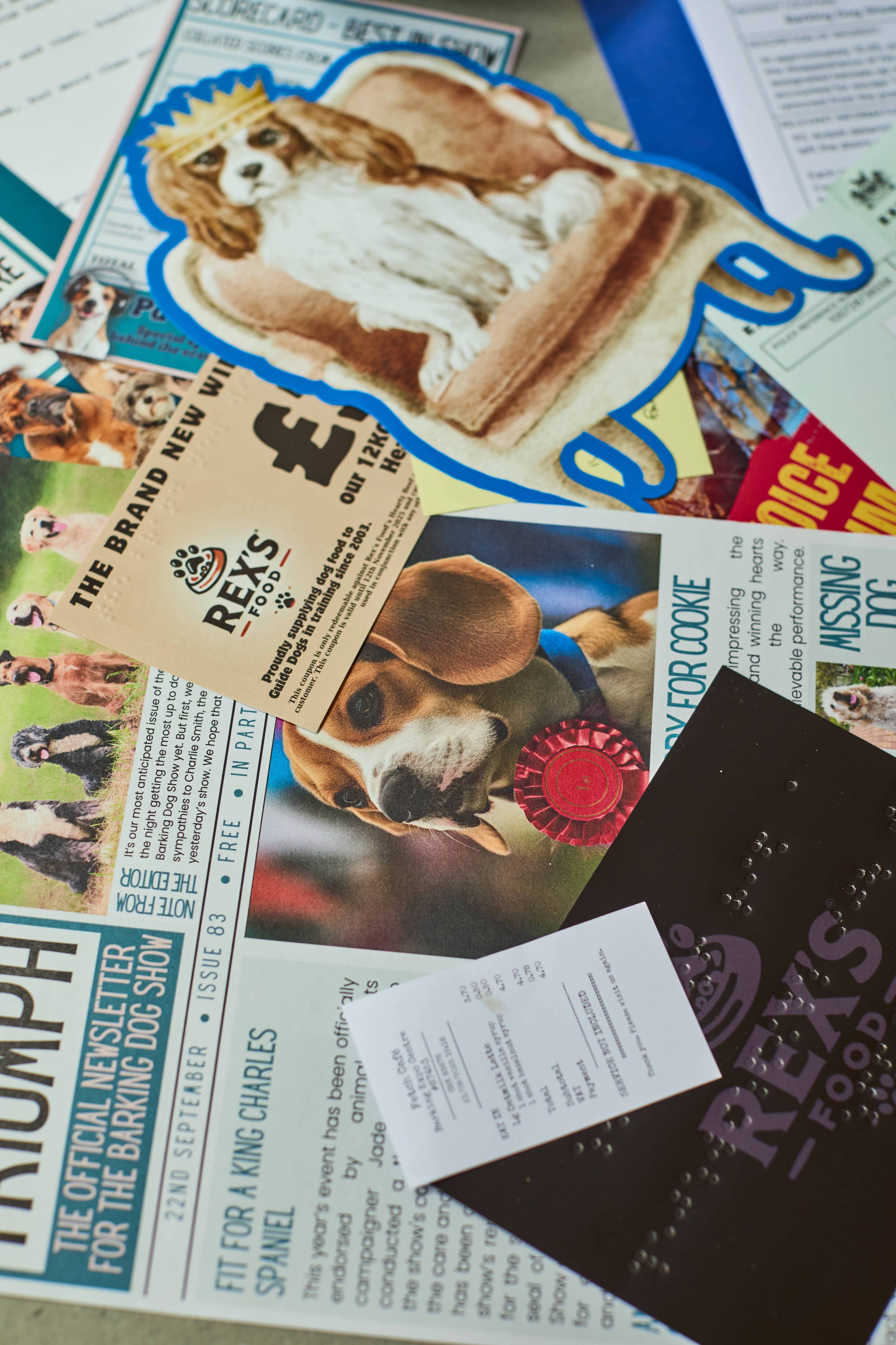Cold Case: Who Let The Dogs Out? game with dog-themed papers and a Rexs Food coupon.