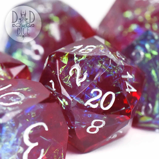 Crown Jewels Bordeaux handmade resin polyhedral dice set, red and iridescent with white numbers.