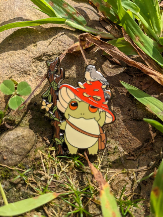 Druid Class Frog hard enamel pin showing a frog in a red wizard hat holding a staff, 1.5 inches.