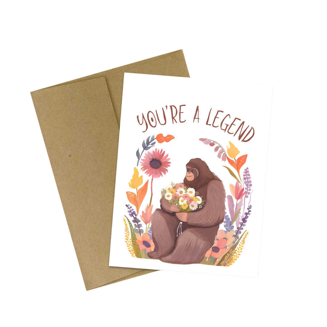 Bigfoot Floral You’re a Legend Card for Friend featuring Bigfoot with flowers and vibrant plants.