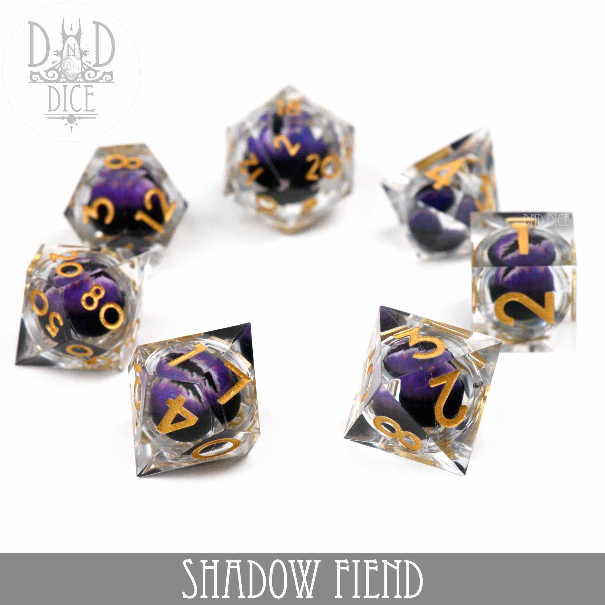 Shadow Fiend - Liquid Core dice set in clear resin with purple and black swirls, gold numbers, on white background.