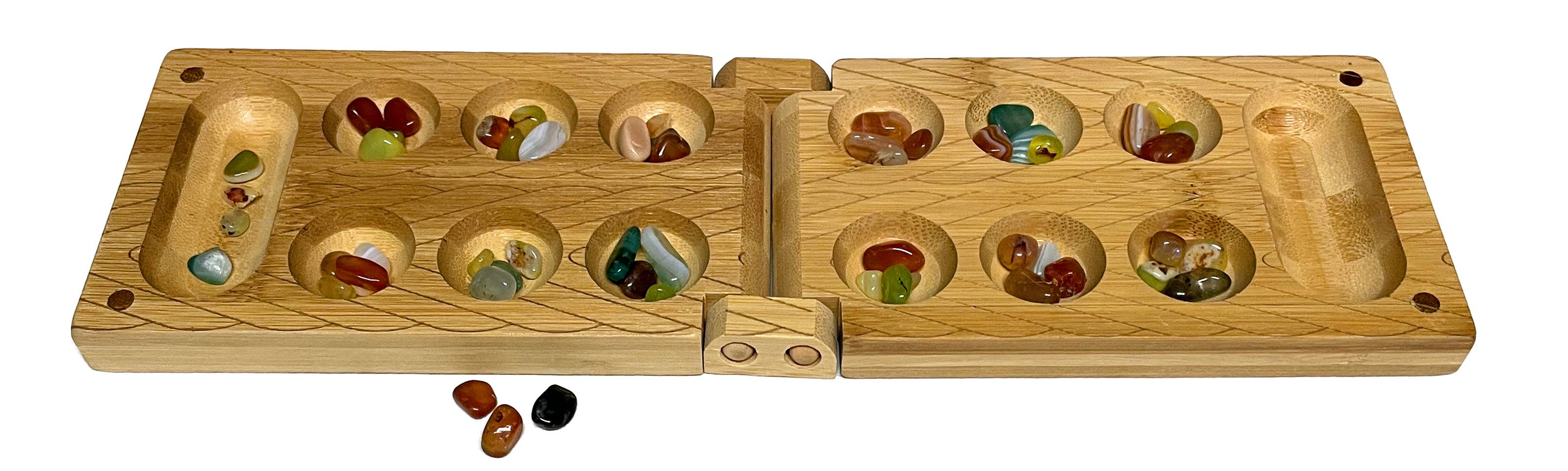 Travel Bamboo Mancala Game with wooden board, colorful glass stones in pits, and extra stones included.