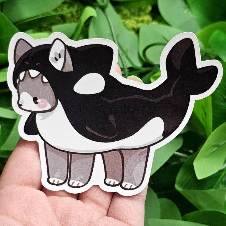 Cats in Sea Creature Costumes sticker featuring a cat in an orca suit.
