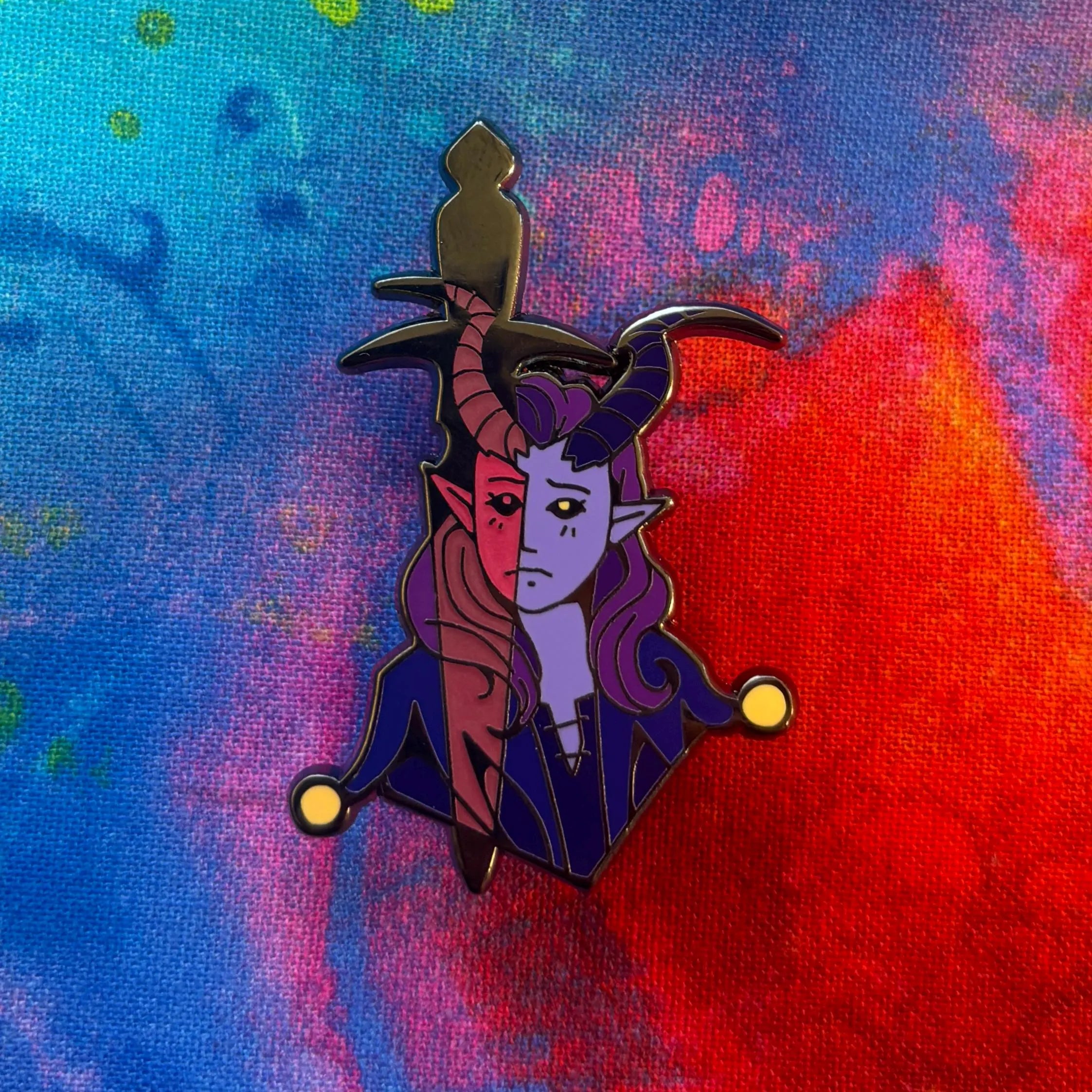 Alfira Pin enamel pin featuring a split character with horns and elf ears on a blue and red background.