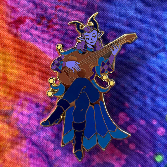Colorful enamel pin of Alfira the Bard playing a lute.