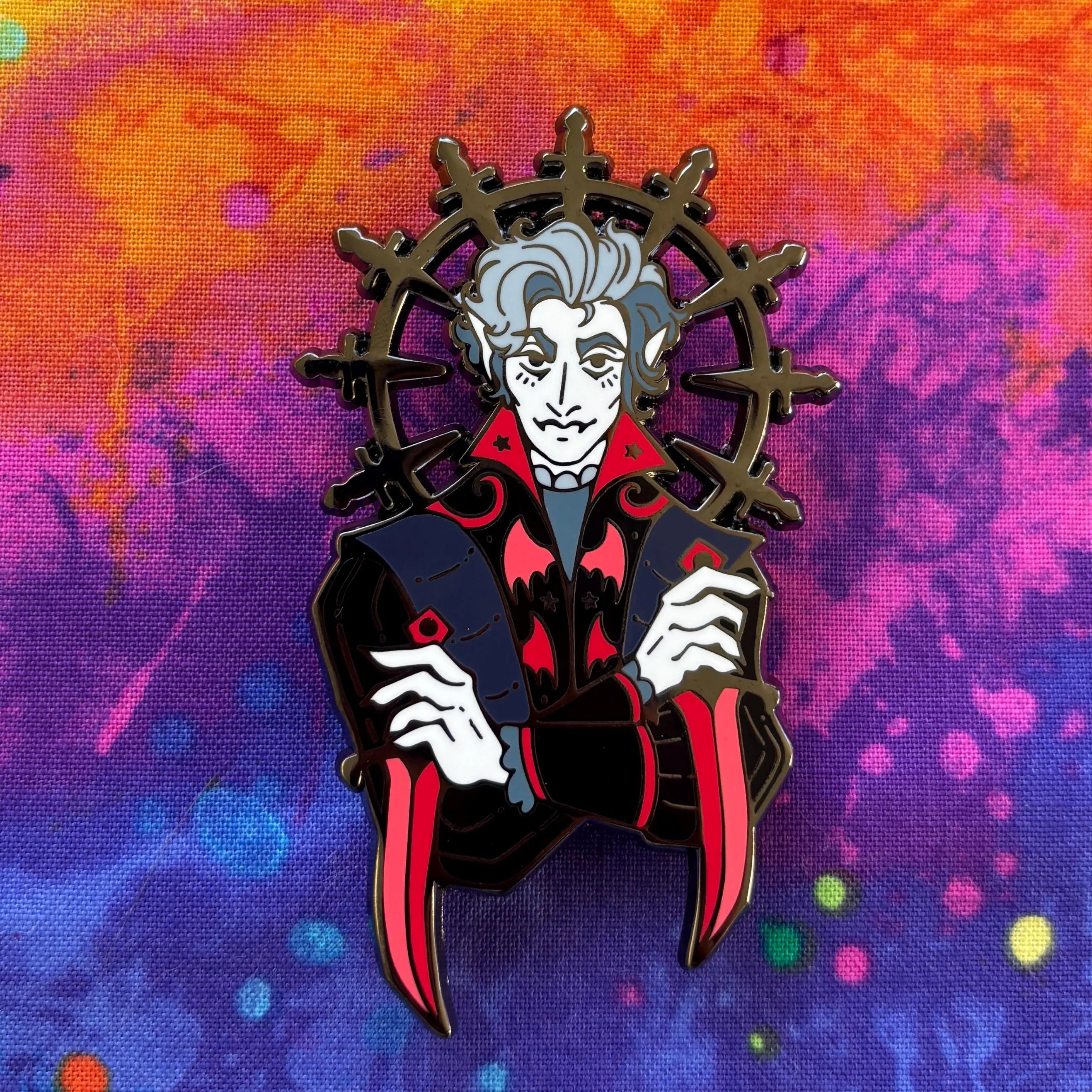 Astarion Pin featuring a stylized vampire with pale skin, red eyes, and bold accents.