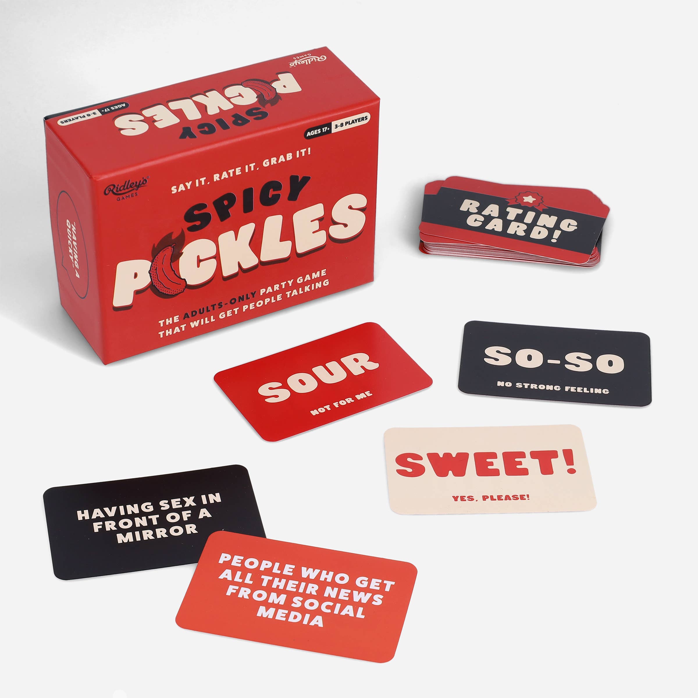 Spicy Pickles adult party game set with rating cards and conversation prompts in front of the box.