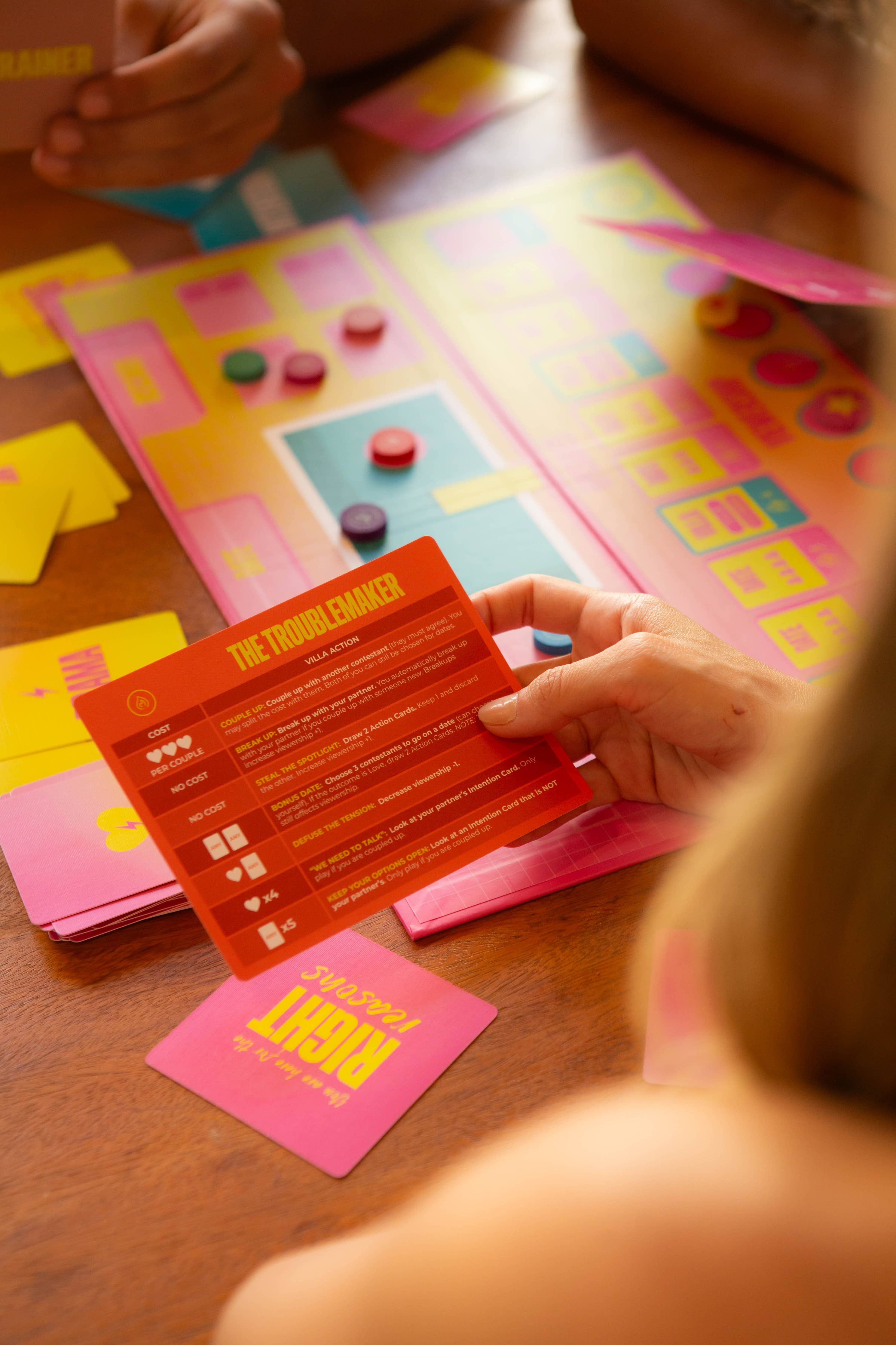 Hand holding a Lovestruck card from Lovestruck - A game about finding love on reality TV.