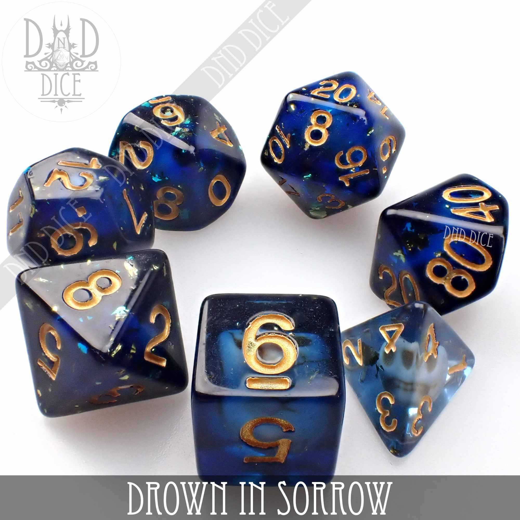Drown in Sorrow set of seven blue and gold resin dice for tabletop games.