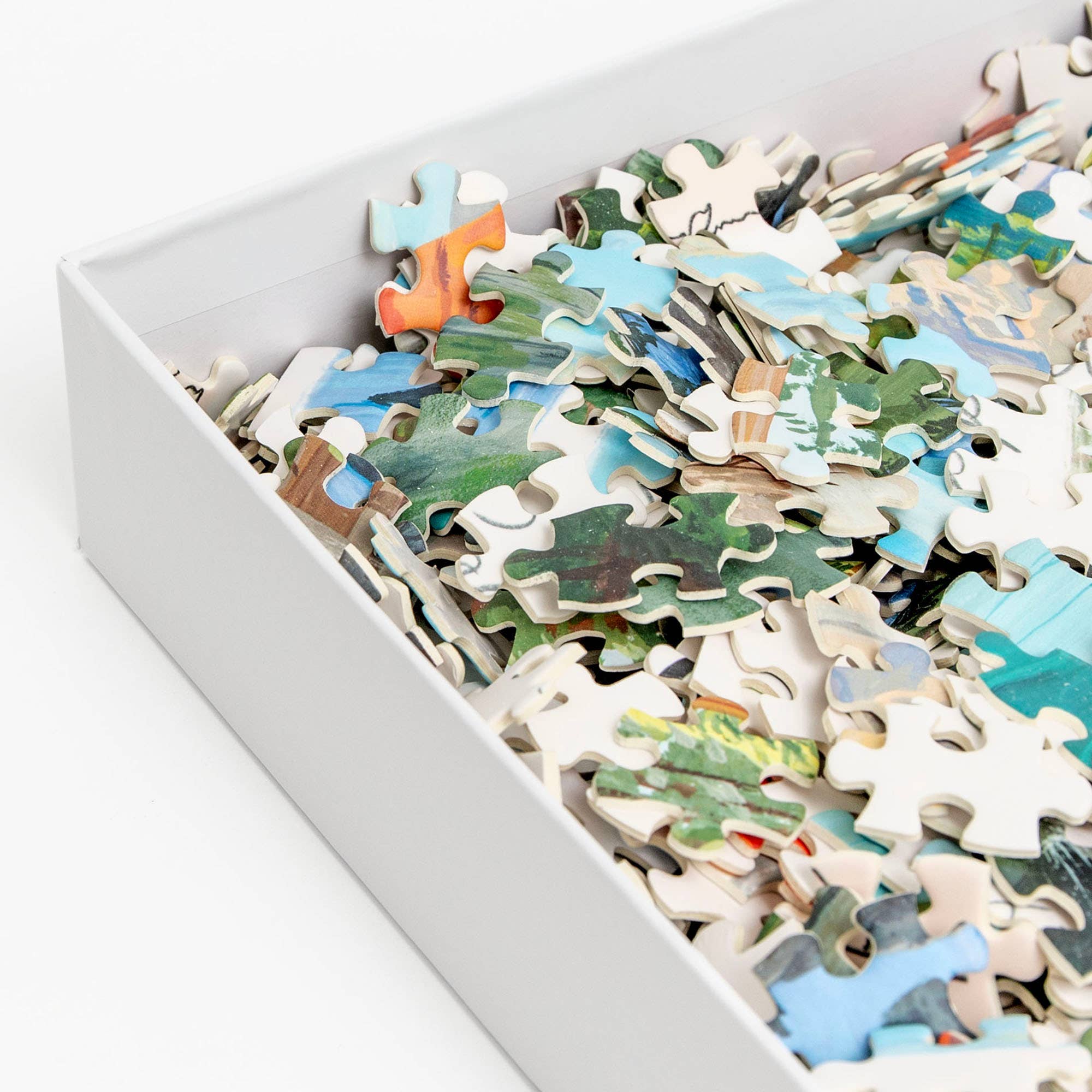 National Parks 1,000 Piece Jigsaw Puzzle pieces scattered inside a white box.