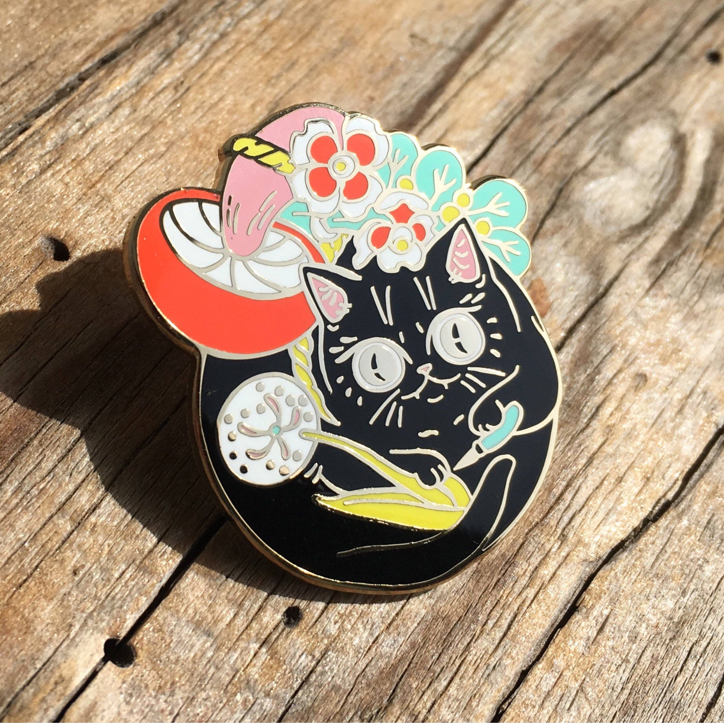 Curious Nature Cat enamel pin of a black cat with stylized flowers and a mushroom.