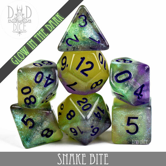 Snake Bite Glow in the Dark resin DnD dice set in green, yellow, and purple with black numbers.