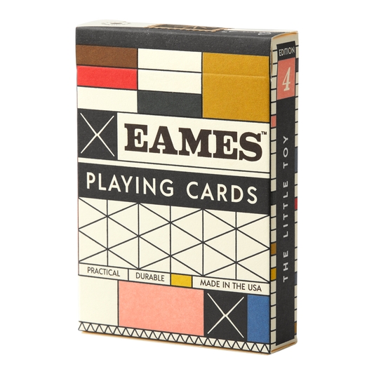 Eames The Little Toy playing cards in a geometric grid box of black, white, red, yellow, and blue.