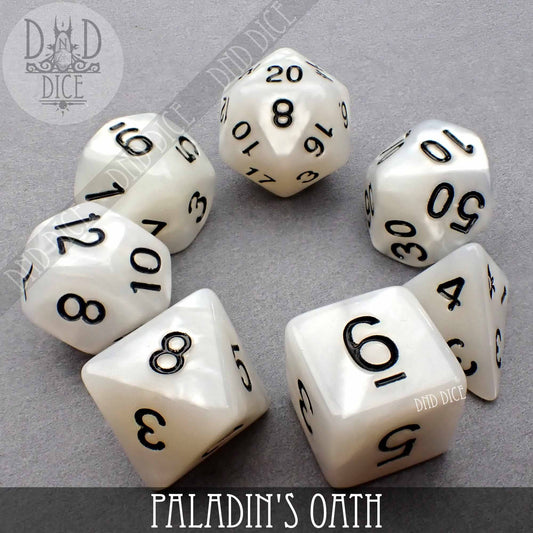 The Holy Order set includes seven white acrylic DND dice with black numbers.