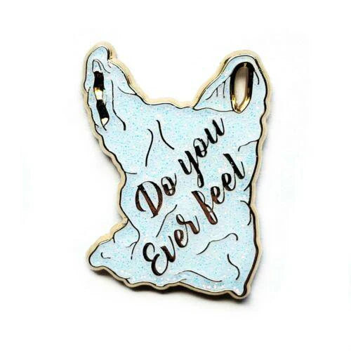 Do You Ever Feel Katy Perry enamel pin shaped like a glittery crumpled plastic bag with script text.