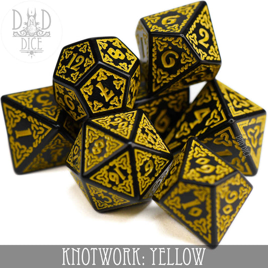 Knotwork: Yellow, set of 7 acrylic dice with gold designs, includes teardrop D4 and ornate D20.