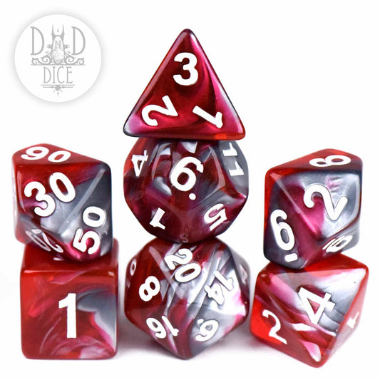 Six Steel and Blood dice in red and black marbled acrylic with white numbers, pyramid stacked.