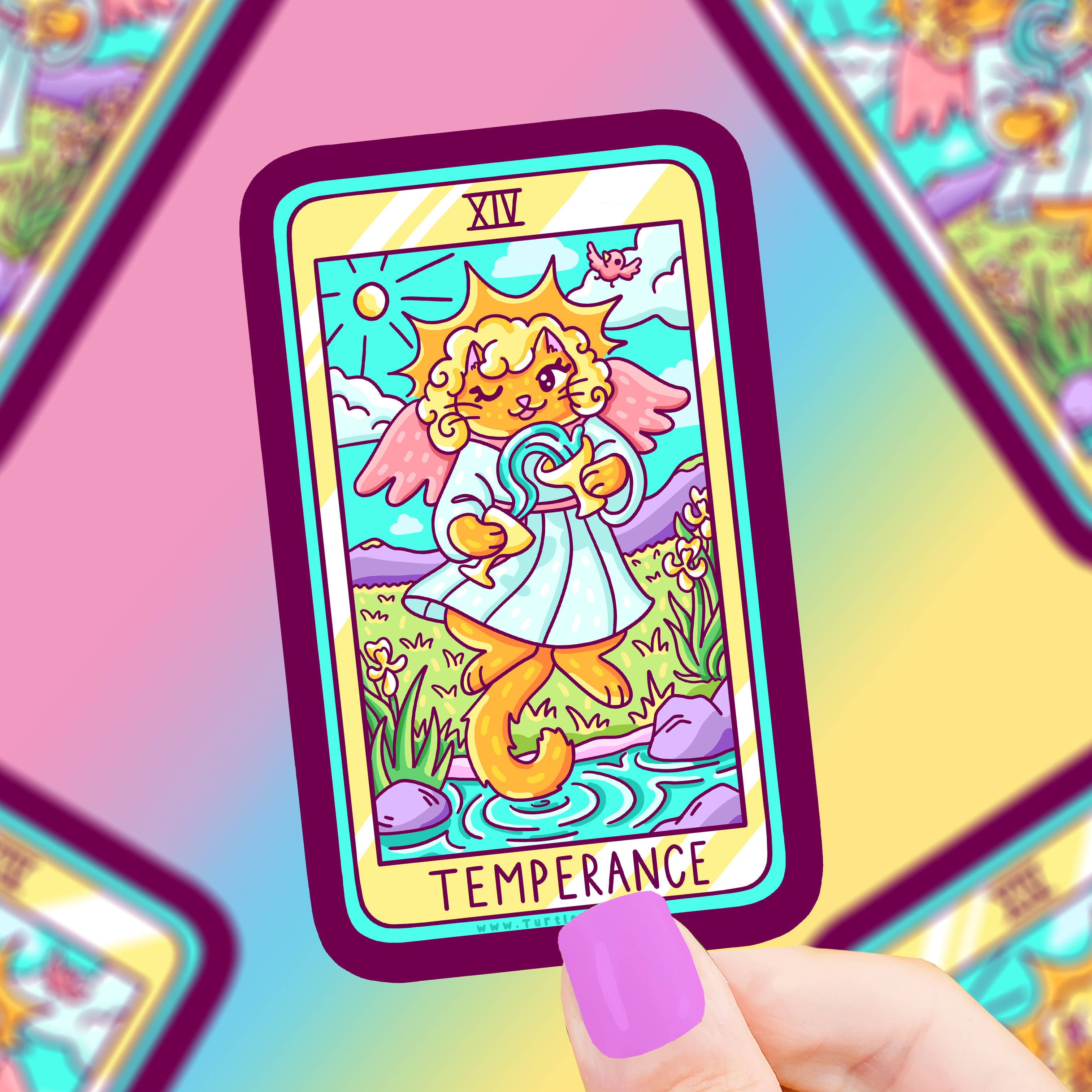 Temperance Cat Major Arcana Tarot Card Vinyl Sticker with a winged cat by a stream, held by a hand with purple nails.