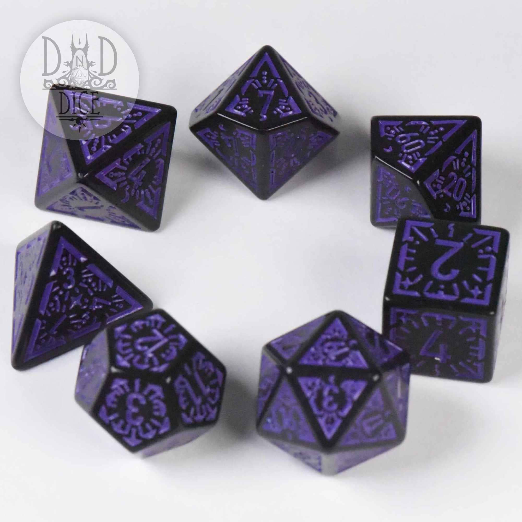 Lunar Eclipse, set of seven black and purple ornate acrylic tabletop gaming dice on a white surface.