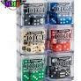 Six clear plastic boxes with Citadel d6 Warhammer Dice sets, each in a different color, 12mm size for tabletop gaming.
