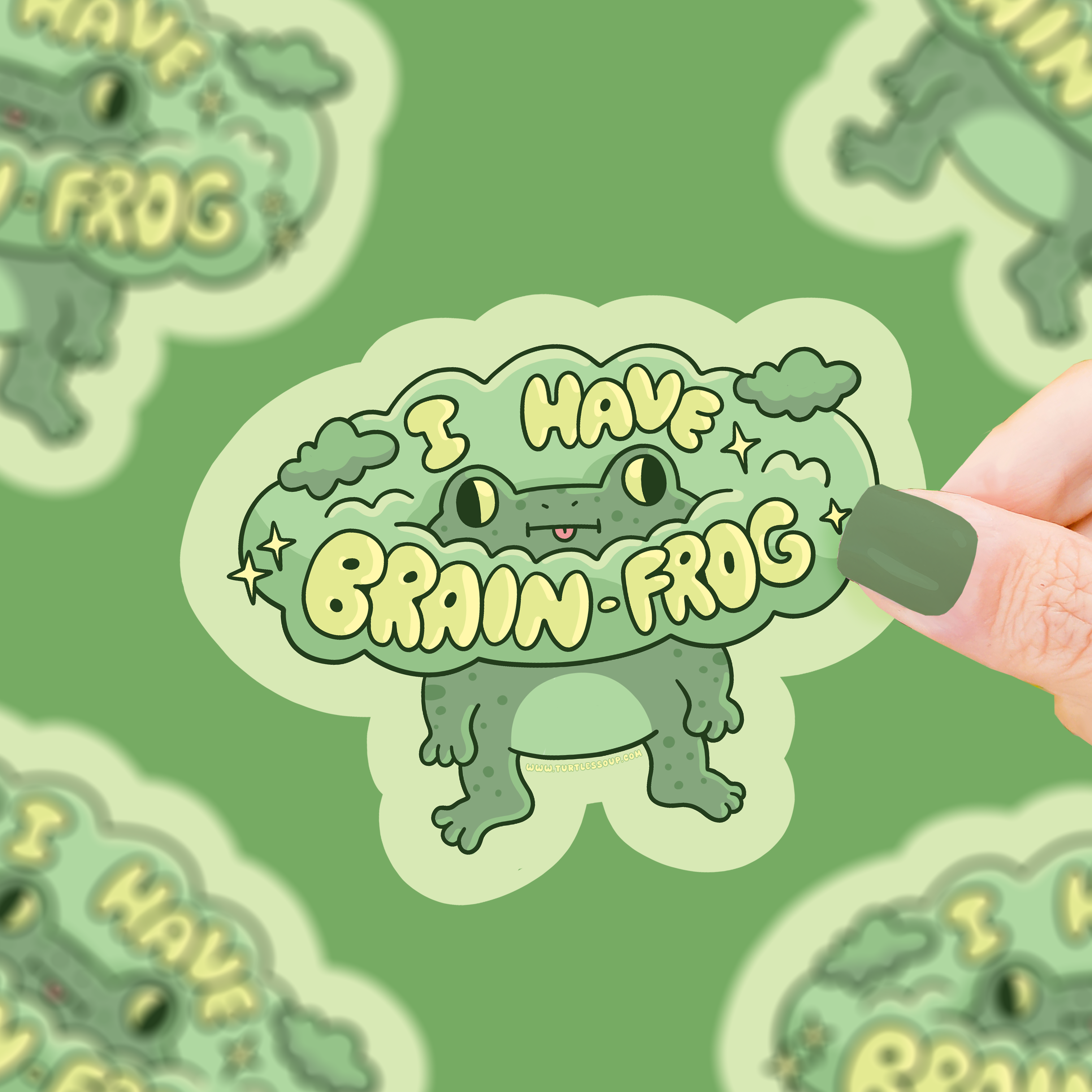 Brain Frog vinyl sticker with I HAVE BRAIN FROG text held in a hand.